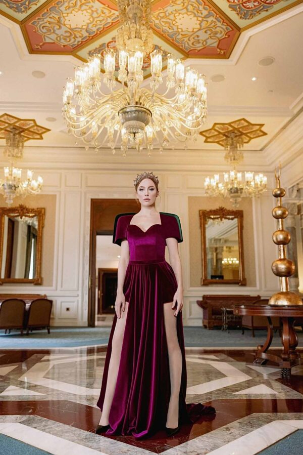 Veloria Dress in deep burgundy velvet with sculpted sleeves and front slits