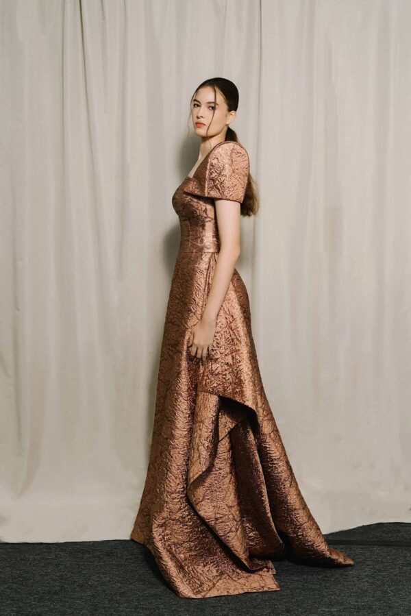 Laiton Lumière dress side view showing architectural short sleeves and side slits