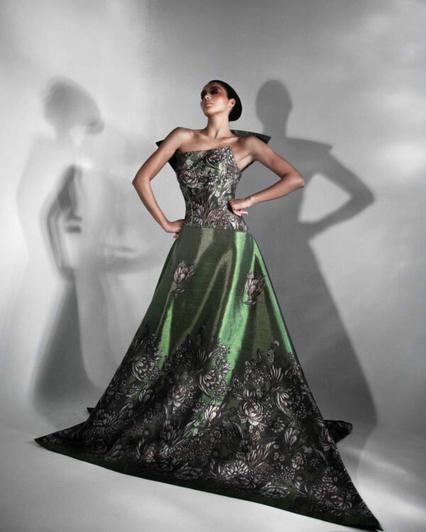 The Caelia Dress front view with sculpted floral motifs and angular shoulders