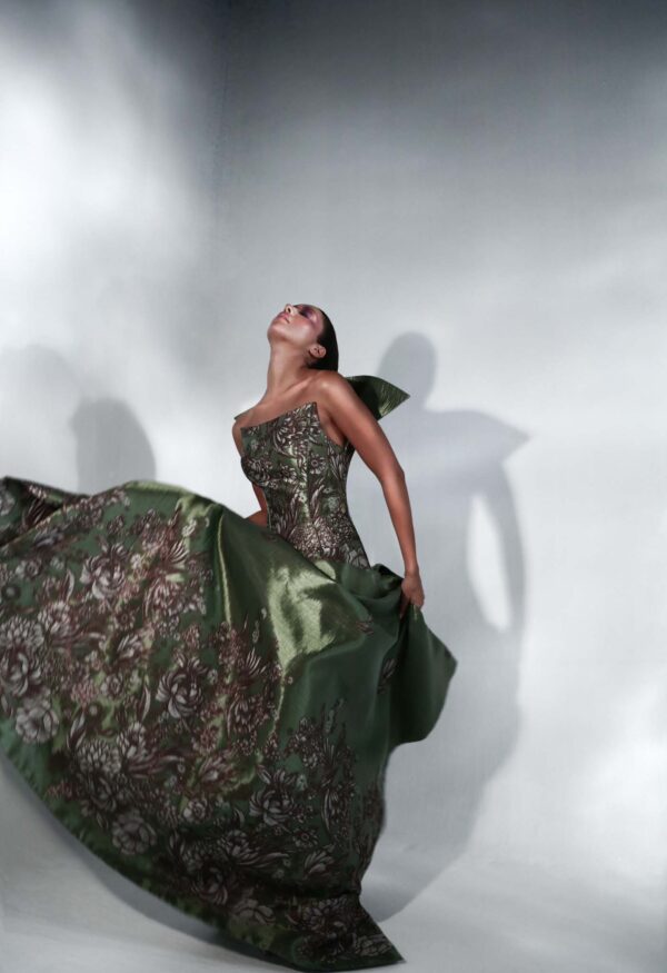 Back view of The Caelia Dress showcasing angular shoulder panels