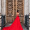 THE ÉCARA red satin gown with voluminous couture train