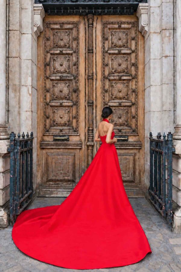 THE ÉCARA red satin gown with voluminous couture train